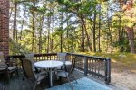 Dine outside surrounded by pitch pines in the privacy of the backyard